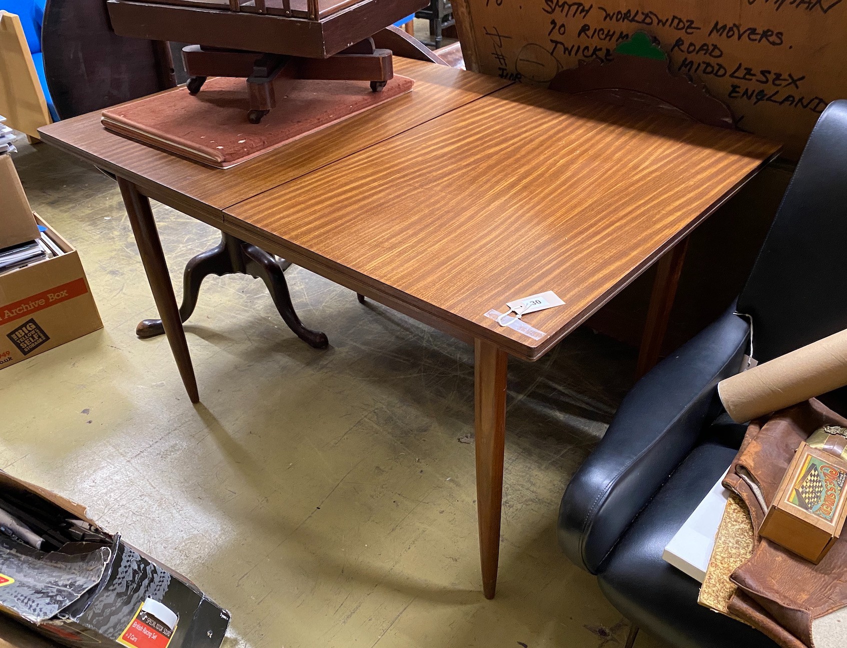 A mid century rectangular teak extending dining table by White and Newton, width 122cm, depth 84cm, height 73cm